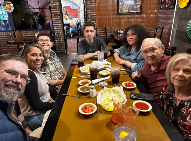 The Pilger family gathered around a table — the heart of KTRM